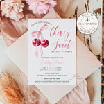 Cherry-themed bridal shower invitation featuring a pair of cherries tied with a soft pink coquette bow. Perfect for celebrating the bride-to-be with a playful yet elegant design, combining vintage-inspired details and a sweet, feminine touch.