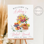 Floral Bridal Brunch Custom Welcome Sign with watercolor design featuring mimosas, fruit, waffles, pastries, greenery, and a floral bouquet background.